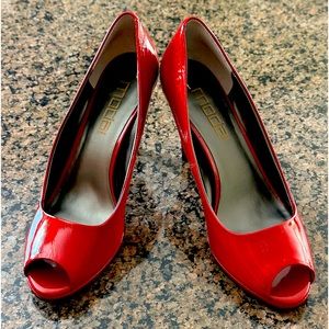 Red open toe pumps